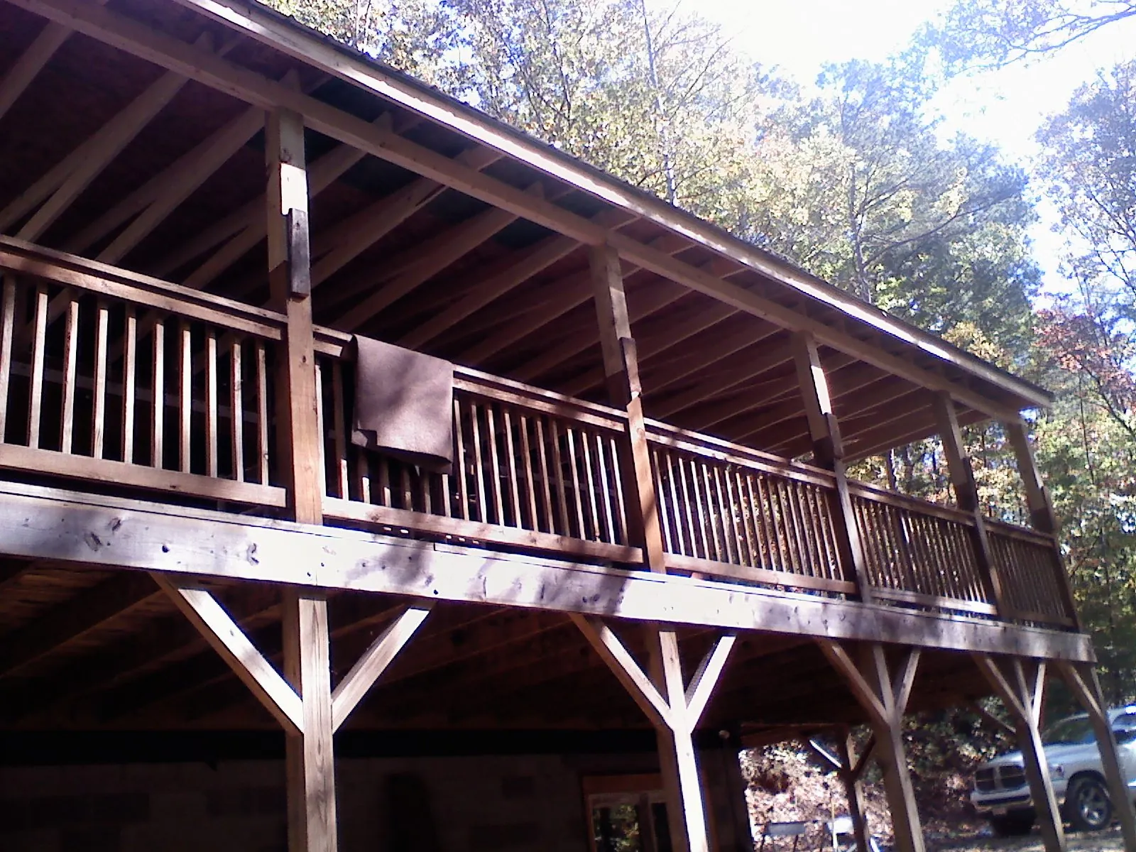 Timber framing under a new elevated porch and deck — Roof Leak Repair in Harbert by Roofing Brothers